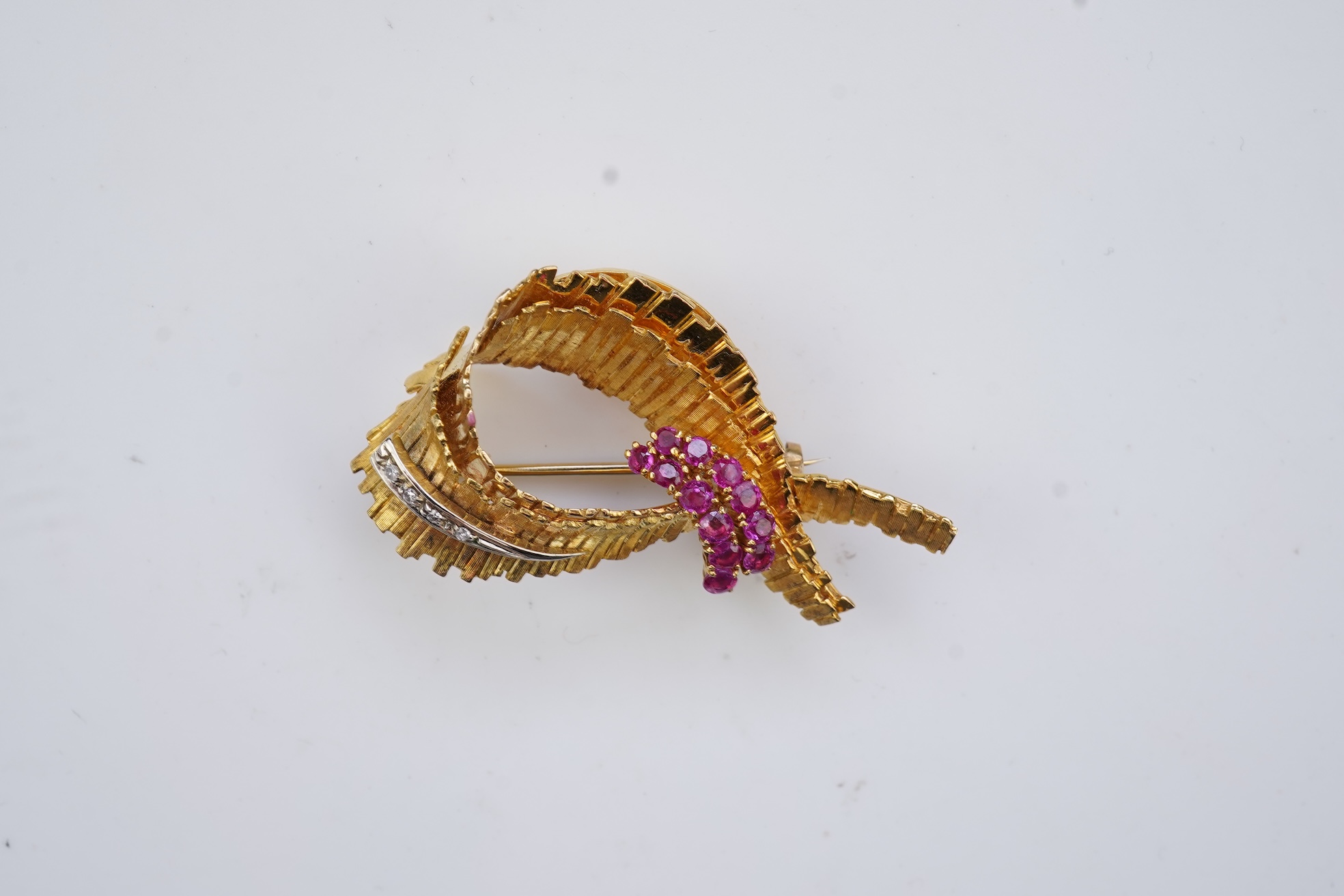 A gold, ruby and diamond brooch, circa 1965